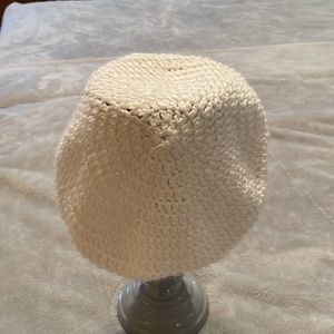 Hand knitted white beret cap. Never been used.  See pictures for measurements.